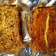Two bricks of smoked cream cheese on aluminum foil